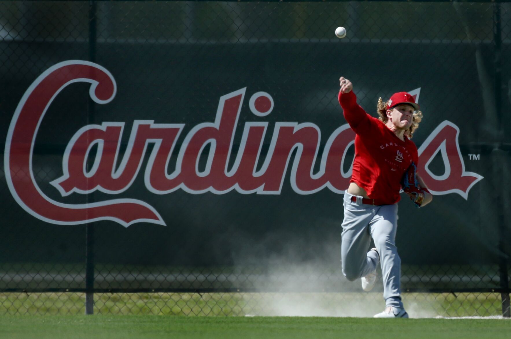 St. Louis Cardinals catcher Yadier Molina arrives on day 8 of team workouts in Jupiter